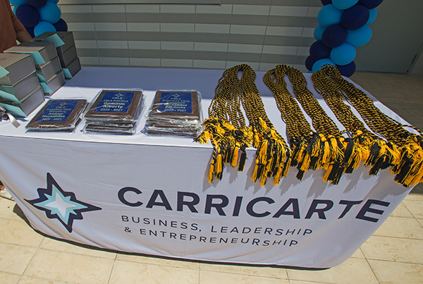 Senior business students at Christopher Columbus High School were honored with plaques and cords of distinction at an event April 15, 2021, marking the naming of the Carricarte Business, Leadership and Entrepreneurship career pathway at the all-boys Miami high school.