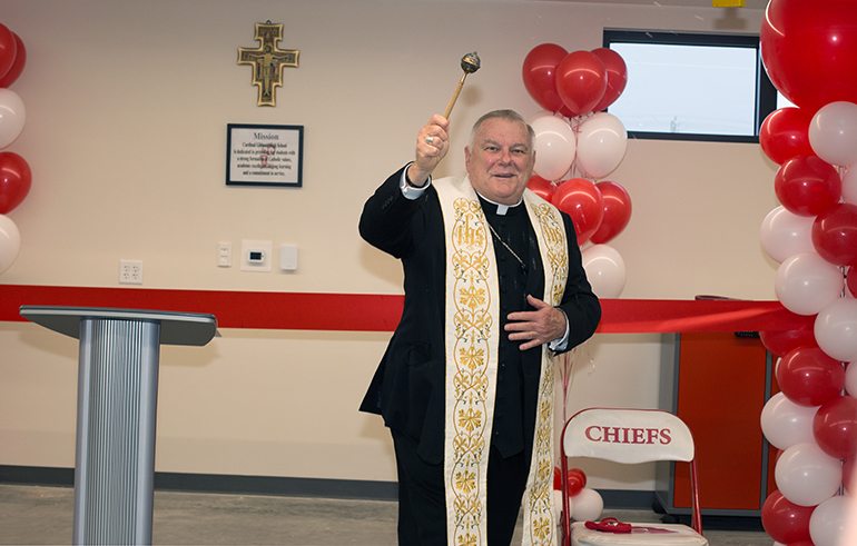 Archbishop Thomas Wenski blesses the Smith Family Building at Cardinal Gibbons High School in Fort Lauderdale, April 21, 2021.