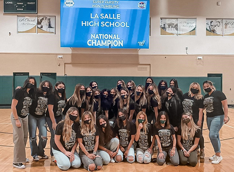 Immaculata-La Salle cheerleaders pose after getting the news they had won the national championship in Super Varsity Non-Tumbling, April 23, 2021. They also won back-to-back Florida state championships. Due to COVID-19, the national competition took place virtually this year.