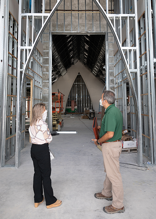 Nancy McCrosson, property manager and bookkeeper at the St. Peter Parish, speaks with David Prada, senior director of Building and Property for the Archdiocese of Miami.