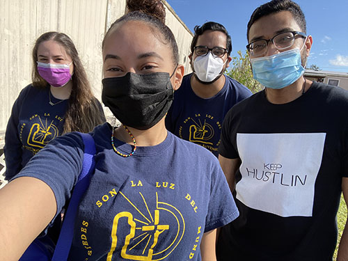 After delivering toys to a community in Homestead, members of Encuentros Juveniles stop for a selfie. From left: Maria Beauchamp, Clarelicia Vega, Joshua Rugama and Eduardo Calvo. In February 2021, the archdiocesan youth movement, for people ages 14-25, was  recognized by the National Federation for Catholic Youth Ministry, and received the St. Katharine Drexel Pathway Award.