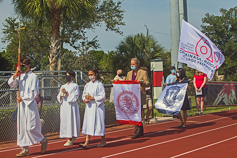 Students, board members and faculty process into Mass for the 60th anniversary of Chaminade-Madonna College Preparatory in Hollywood, April 25, 2021. The Mass was held on the school's Vince Zappone Field.