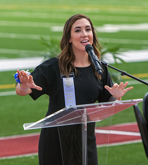 Founders' Award recipient Samantha Stokesberry addresses those in attendance at Chaminade-Madonna College Preparatory's 60th anniversary Mass, celebrated April 25, 2021 at the school's Vince Zappone Field.