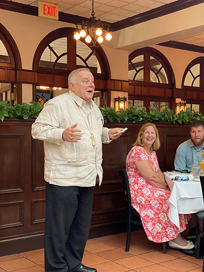 Archbishop Thomas Wenski welcomes participants to the Cheers for Charity event held at Joe's Stone Crabs on Miami Beach, April 28, 2021.