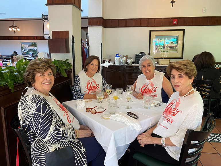 Enjoying the Cheers for Charity event held at Joe's Stone Crabs on Miami Beach, April 28, 2021, are Gloria Arazoza (third from left) and her friends, Olga Campano, Elena Ramos and Georgina Garcia.