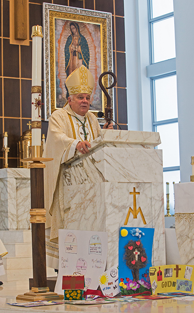 Archbishop Thomas Wenski preaches his homily at the annual annual awards Mass for Catholic Scouts, celebrated May 1, 2021 at Our Lady of Guadalupe Church in Doral.