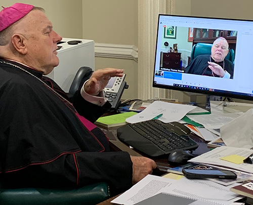 Archbishop Thomas Wenski watches himself speaking to sixth graders from throughout the Archdiocese of Miami during the virtual version of Focus 11, held May 5, 2021. The event's goal is to help young people consider their vocation in general, and a vocation to the priesthood or religious life in particular. Focus 11 was held virtually this year due to the COVID-19 pandemic.