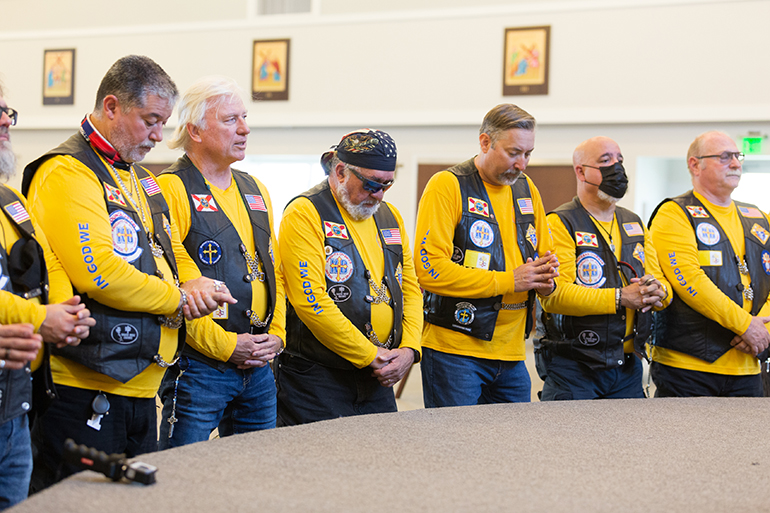 Knights on Bikes pray before the start of the first Knights of Columbus-affiliated Ride for Vocations conducted in Florida and held May 27, 2021 starting at St. Katharine Drexel in Weston.