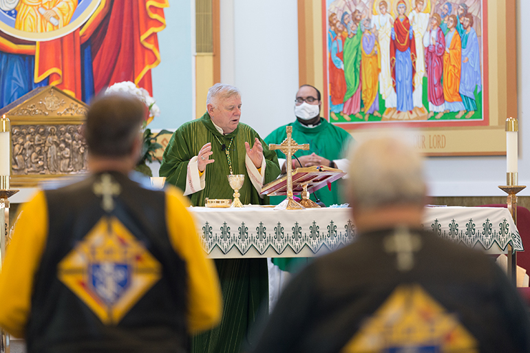 Accompanied by Father Matthew Gomez, archdiocesan vocations director, Archbishop Thomas Wenski celebrates Mass at the start of the first Knights of Columbus-affiliated Ride for Vocations conducted in conjunction with the Knights on Bikes organization of Florida and held May 27, 2021 starting at St. Katharine Drexel in Weston. After celebrating the Mass, Archbishop Wenski led the ride all the way to the Knights of Columbus Kissimmee Council Hall No. 6624 south of Orlando. All donations benefited Florida seminarians.