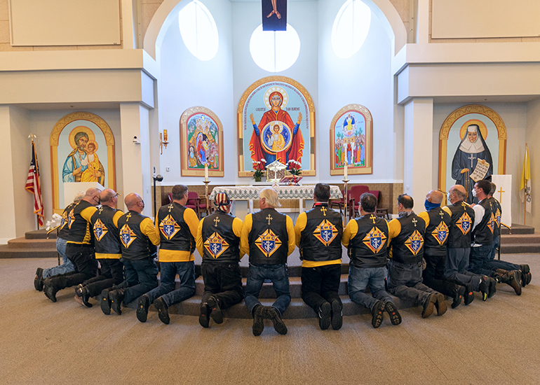 Knights on Bikes pray before the start of the first Knights of Columbus-affiliated Ride for Vocations conducted in Florida and held May 27, 2021 starting at St. Katharine Drexel in Weston. Miami Archbishop Thomas Wenski celebrated a morning Mass and led the ride all the way to the Knights of Columbus Kissimmee Council Hall No. 6624 south of Orlando. All donations benefited Florida seminarians.