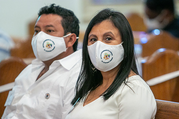 Jose Cruz and Anabel Ascencio of St. Stephen Parish in Miramar, wearing facemasks that denote they are also extraordinary ministers of holy Communion, are graduates of the 2020 lay formation class held at St. Bartholomew Church in Miramar.

Archbishop Thomas Wenski presided at a Mass and graduation ceremony for the 2020 and 2021 School of Lay Formation classes, June 5, 2021 at St. Mary Cathedral. The graduation ceremony for the class of 2020 was postponed last year due to COVID-19.