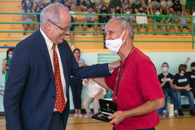 Miami Beach Mayor Dan Gelber presents the Key to the City to Art Fernandez, who is retiring after 39 years as St. Patrick School's physical education teacher.