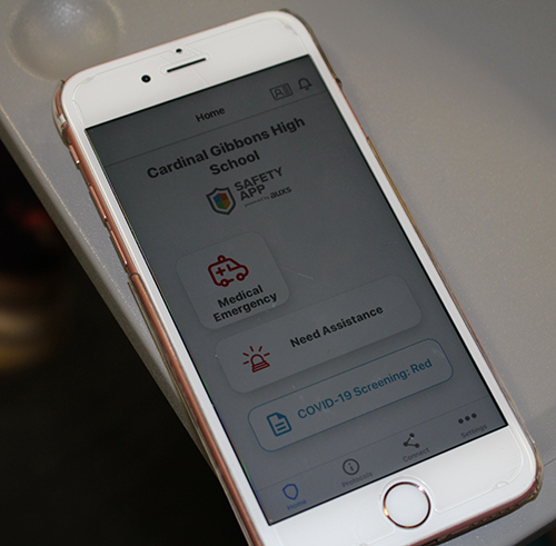 A mobile safety application is part of Cardinal Gibbons High School students' school gear these pandemic days. Upon arriving to school, students use the application to check in and get cleared for their school day.