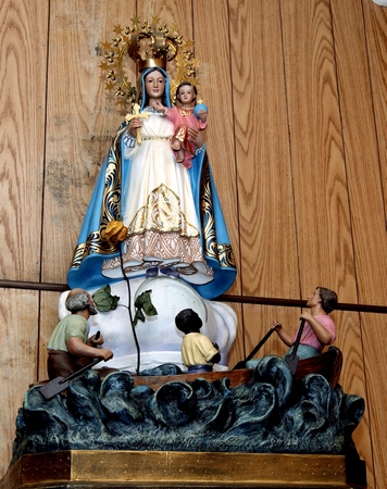 A statuette of Our Lady of Charity embodies the church's closeness with the surrounding Cuban-American community.