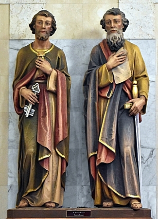 The dual patron saints of the church look out over the nave. St. Peter, left, is shown with the keys to the kingdom of heaven, given him by Jesus. Paul holds one of the 13 New Testament manuscripts ascribed to him -- and the sword with which he was martyred.