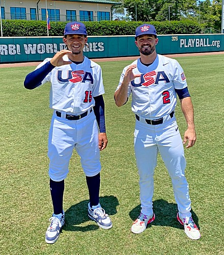 Jon Jay, left, and Eddy Alvarez make the capital 'C' gesture for their alma mater, Christopher Columbus High School. Both will join the U.S.A. baseball beam for the Summer Olympics in Tokyo.