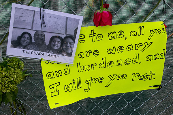 An image of the Guara family, parishioners at St. Joseph on Miami Beach, is posted on one of several walls of remembrance that have sprung up. This one is at one of the entrances to Stella Maris, a residence for seniors operated by Catholic Health Services. On June 29 and 30, officials confirmed that Marcus Guara, 52, his wife, Anaely, 42, and their daughters, Emma, 4, and Lucia, 11, perished in the collapse.