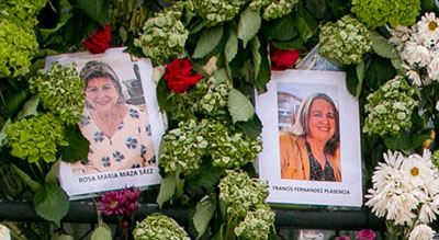 Photos of Rosi Maza, left, and Francis Plasencia as seen on the wall of remembrance for those killed in the collapse of the Champlain Towers South condominium. The wall is on the fence of a tennis court just west of the collapsed building.