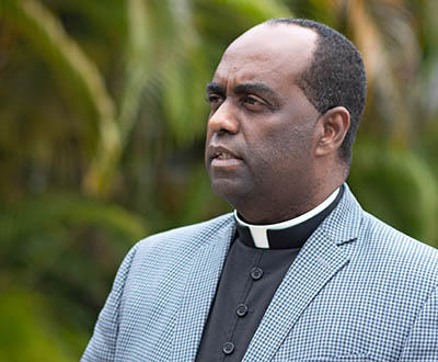 Father Reginald Jean-Mary, administrator of Notre Dame d'Haiti Mission in Miami, talked to the media before leading a eucharistic adoration and afternoon prayer vigil for Haiti on July 7, 2021 in light of the assassination earlier in the day of Haiti's embattled President Jovenel Moisé.