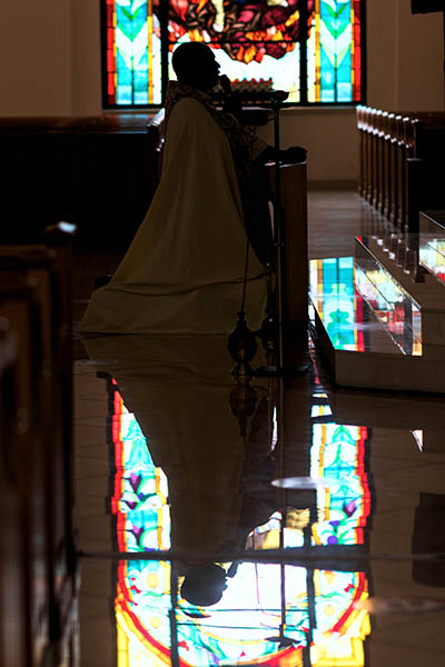 Father Reginald Jean-Mary, administrator of Notre Dame d'Haiti Mission in Miami, leads a eucharistic adoration and afternoon prayer vigil for Haiti on July 7, 2021 in light of the assassination earlier in the day of Haiti's embattled President Jovenel Moisé. The community also prayed for Haiti's First Lady, who was injured in the attack and flown to Miami for medical care.