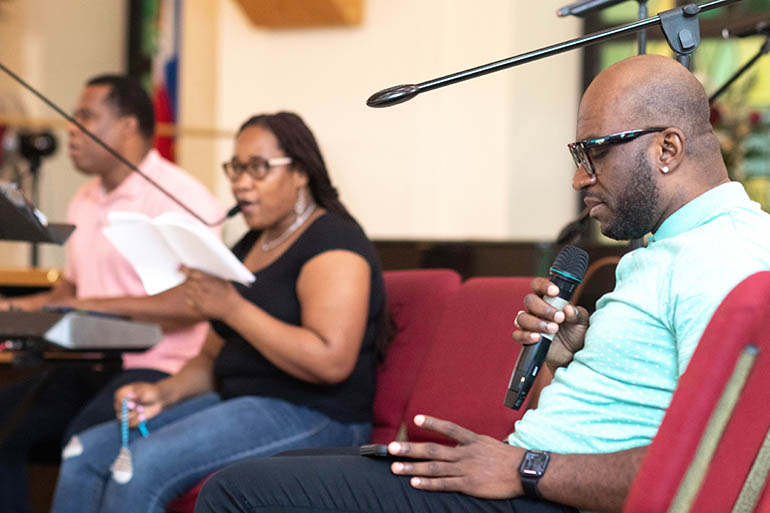 Members of the choir pray at Notre Dame d'Haiti Mission in Miami during a eucharistic adoration and afternoon prayer vigil for Haiti held on July 7 in light of a reported assassination earlier in the day of Haiti's embattled President Jovenel Moisé. The community also prayed for Haiti's First Lady, who was injured in the attack and flown to Miami for medical care.