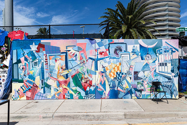 A tribute to Surfside victims created by Texas-based artist Roberto Marquez is also part of the "wall of remembrance" at Surfside.