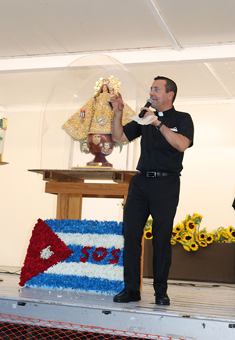 Father Jean Gonzalez Romero, a priest from Guantanamo, Cuba, who organized the July 14, 2021 vigil at the National Shrine of Our Lady of Charity, said “today we continue a living rosary facing these waters, the only part of Biscayne Bay uninterrupted by anything. These waters unite with the waters of Cuba. That’s why, with our hearts here, with our hearts there, and our prayers from here.”