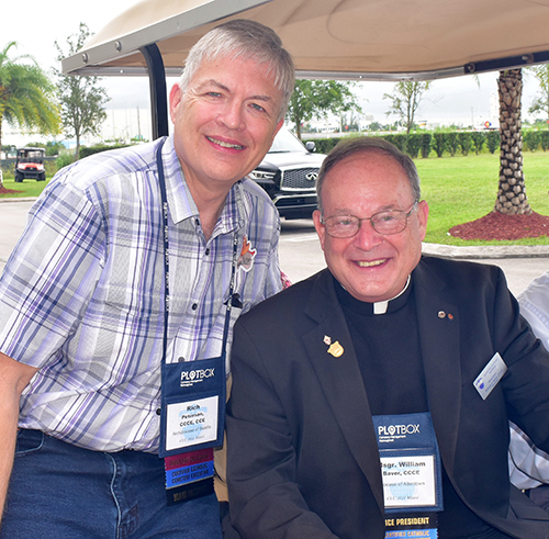 Top officials of the Catholic Cemetery Conference pause before touring Our Lady of Mercy Cemetery in Doral. From left are Richard P. Peterson, president, and Msgr. William F. Baver, vice president.