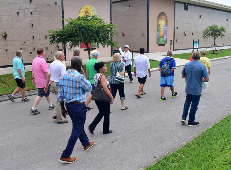 Counselor Marbelys Grecco leads attendees of the Catholic Cemetery Conference to a mausoleum at Our Lady of Mercy Cemetery during their visit, Sept. 21, 2021.