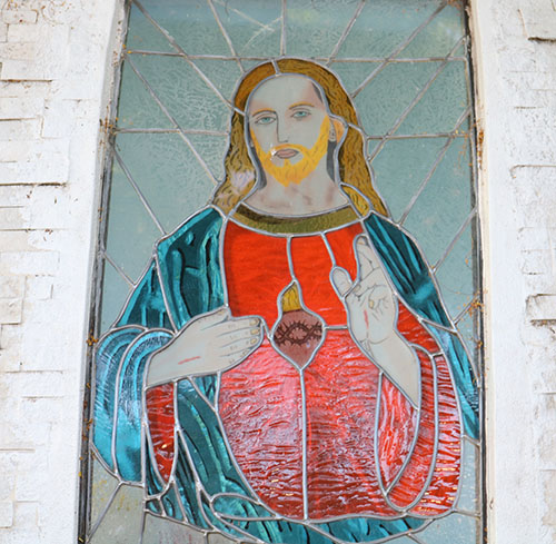 An image of the Sacred Heart of Jesus is displayed on the grounds of San Isidro Parish in Pompano Beach, one of many displayed on the parish grounds and in the church, where 72 parishioners became new members of the Guard of the Sacred Heart on its feast day, June 11, 2021.