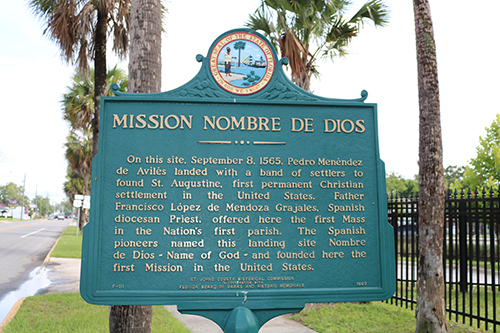 A state marker details the history of Mission Nombre de Dios where Spaniards came ashore and founded St. Augustine. It is here where the first Mass was celebrated and the first Catholic church and Marian shrine were built.