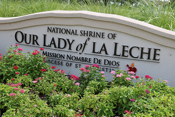 A sign at the entrance to Mission Nombre de Dios reminds visitors that the grounds hold the National Shrine of Our Lady of La Leche along with the church.