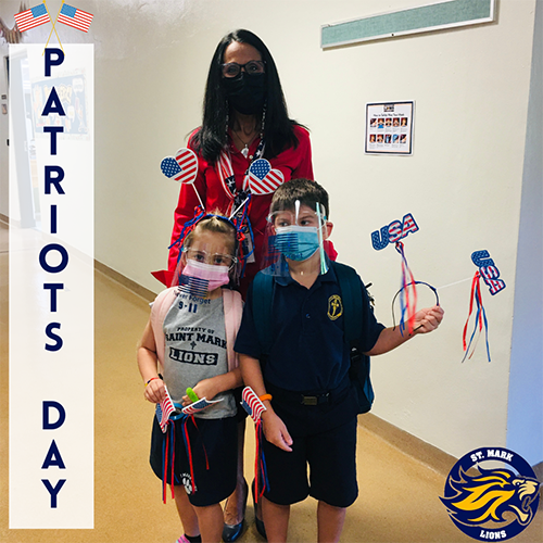 Principal Teresita Wardlow poses with a couple of St. Mark students holding up flags to mark Patriots Day, this year leading up to the 20th anniversary of the Sept. 11 attacks.