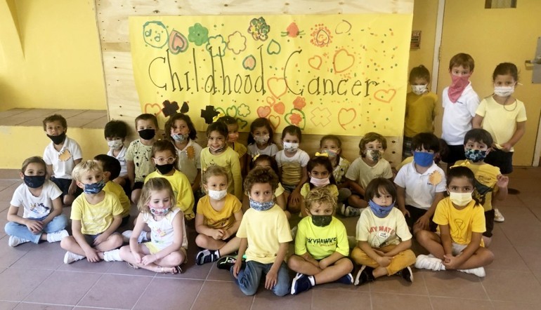 PreK-4 class decks out in gold for Childhood Cancer Awareness Month at St. Agnes Academy.