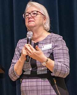 Grace Veloz, director of Stewardship for the archdiocesan Office of Development, speaks to the more than 250 volunteers and parish staff who gathered at Belen Jesuit Prep Oct. 2, 2021, for the Stewardship and Ambassadors of First Impressions Day.