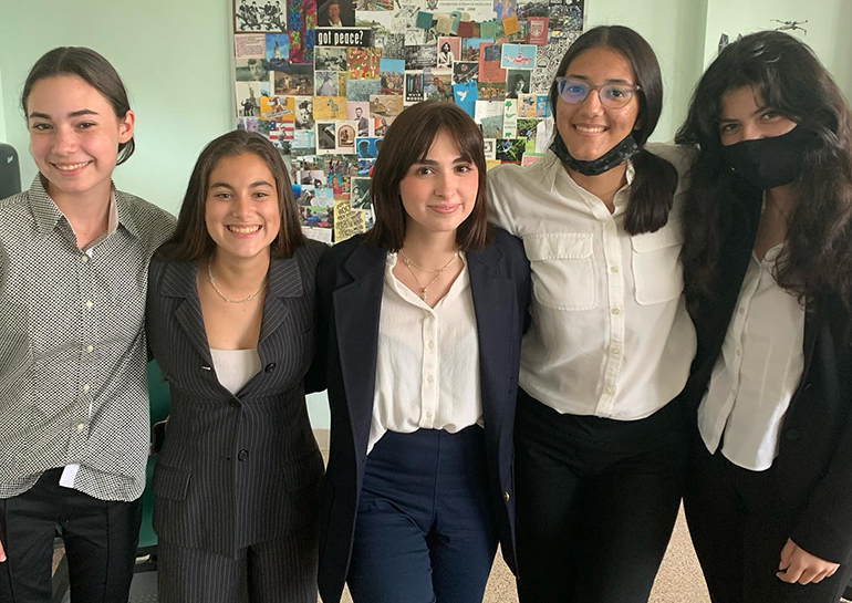 Some of the members of Immaculata-La Salle High School's debate team pose for a photo.