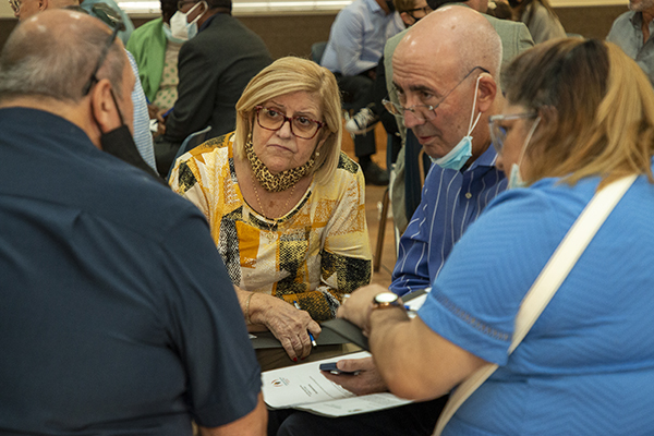 Luz Lopez of Mother of Christ Parish in Miami listens intently as synod members take part in the same small group consultation that they will lead at their parishes in the coming weeks after taking part in the opening Mass of the archdiocesan portion of the Synod on Synodality, Oct. 17, 2021.