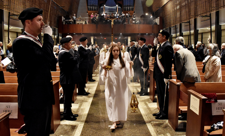 Knights of Columbus form a color guard for the procession during the 70th anniversary Mass at Epiphany Church, South Miami.