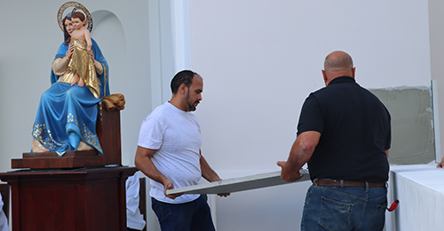 Masons prepare to lay the cornerstone of Our Lady of Belen Chapel at Belen Jesuit Preparatory School, Oct. 30, 2021.