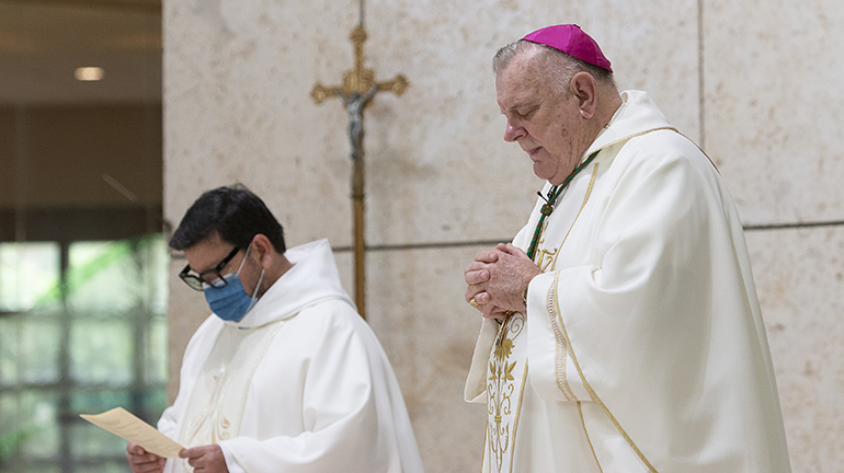 Archbishop Thomas Wenski, accompanied by Father Jaime Acevedo, pastor of St. Mark Parish in Southwest Ranches, celebrates the opening Mass of the 2021 Catechetical Conference, which brought nearly 700 school teachers and catechists - representing every church and school in the archdiocese - to Archbishop Edward McCarthy High Nov. 6, 2021.