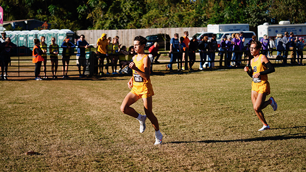 Belen Jesuit sophomore Evan Torres, front, runs toward the finish line with junior Roberto Leon close behind during the state cross-country championships, held Nov. 12, 2021 in Tallahassee. Belen came away with its fifth straight title, and 13th overall.