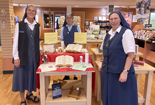 From left, showing the Bible stands she crafted, Pauline Sister Irene Regina. With her are her fellow Daughters of St. Paul, Sister Teresa Meza, center, and Sister Jennifer Tecla, right.