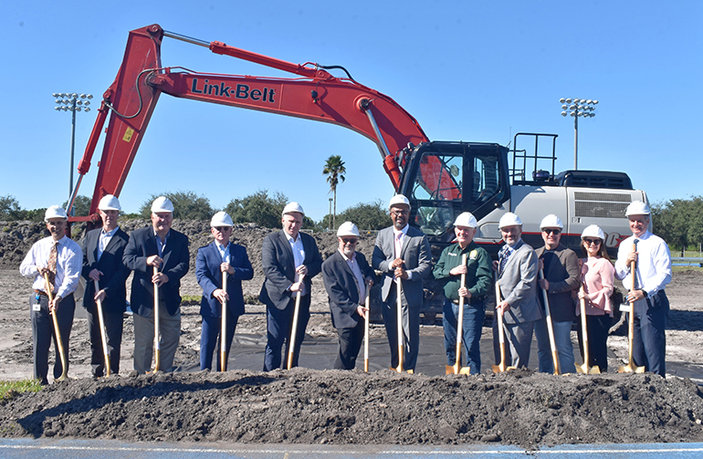 Donors join town and school officials to break ground Nov. 30, 2021 for a new athletic field at Archbishop McCarthy High School in Southwest Ranches.