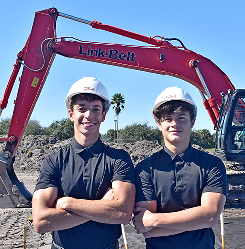 Members of the soccer team for Archbishop McCarthy High attend the groundbreaking Nov. 30, 2021 for a new athletic field at the school in Southwest Ranches. From left are Sebastien Gonzalez and Samuel Garcia.