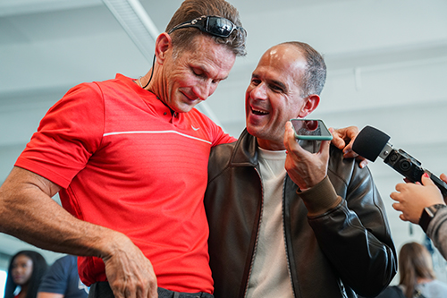 Christopher Columbus alumnus and entrepreneur Marcus Lemonis, right, shares a moment with Billy Desmond, whose family took the young Lemonis under its wing decades ago. Lemonis' $ 10 million donation to the school, announced Dec. 9, 2021, will fund the Desmond Family Success Center, a specialized center that will provide disadvantaged youths with counseling, tutoring, even food if needed.