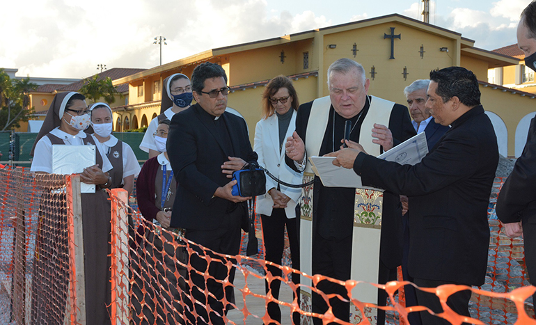 Taking part in the Dec. 15, 2021 blessing of St. Agnes Parish's Building with JOY construction project, from left: Servants of the Pierced Hearts of Jesus and Mary, St. Agnes' pastor, Father Juan Carlos Paguaga, Amy Easton, chairperson of Building Committee, Archbishop Thomas Wenski, and Ed Easton, co-chairperson of the Building Committee. The parish is building a new church and multipurpose center/gymnasium.