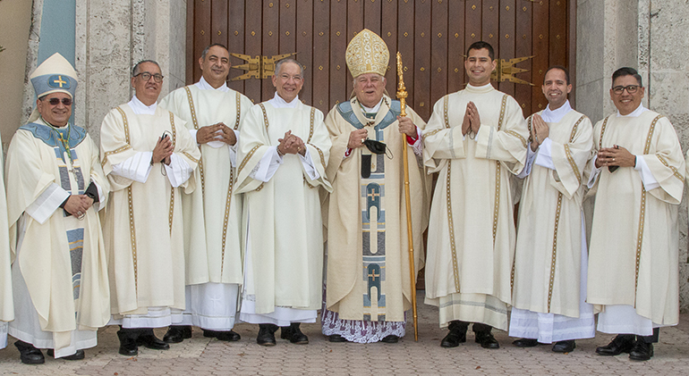 Deacons pose with Archbishop Thomas Wenski after their ordination, from left: Auxiliary Bishop Enrique Delgado; newly ordained Deacons Jose David Mercado, Inran Emilio Infante, and Francisco Alvarez-Gil; the archbishop; newly ordained Deacons Enzo Rosario Prendes, Ramon David Gonzalez and Erick Jose Cinco.
Archbishop Thomas Wenski ordained six deacons Dec. 18, 2021 at St. Mary Cathedral. Five of them are married men, or permanent deacons, one is a transitional deacon, who ultimately will be ordained a priest.