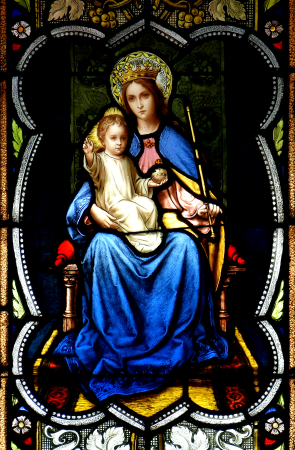 Our Lady of Coromoto, patroness of Venezuela, is the subject of this window in the chapel at St. John Bosco.