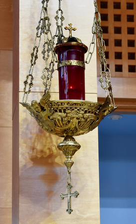 Smiling cherubim surround the base of the Eternal Flame at the chancel of St. Agatha.