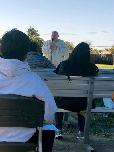 Archbishop Thomas Wenski preaches the homily while celebrating Easter Sunday Mass April 4, 2021 with unaccompanied minors at the Msgr. Bryan O. Walsh Children's Village operated by Catholic Charities in southern Miami-Dade County.